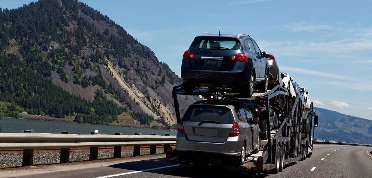 cars on truck in mountains